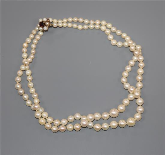 A double strand cultured pearl choker necklace with 9ct gem set clasp, 35cm.